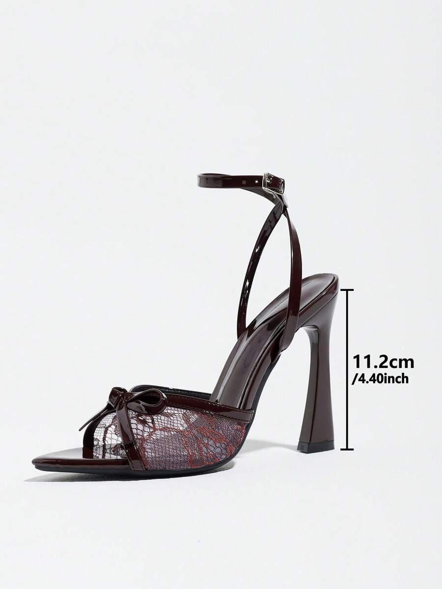 Burgundy open-toe high heels featuring an adjustable ankle strap with buckle closure and high stiletto heel.