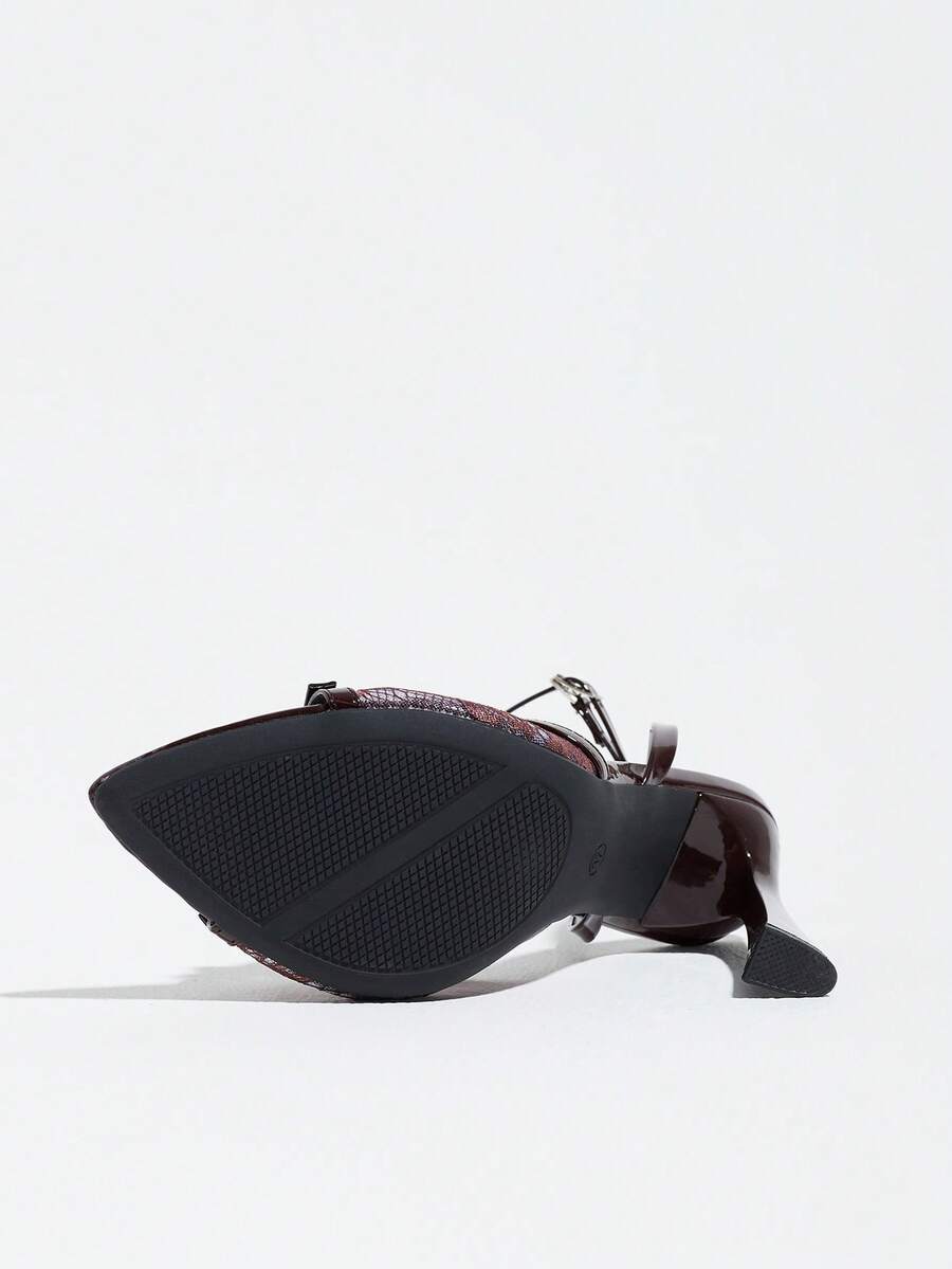 Burgundy open-toe high heels featuring an adjustable ankle strap with buckle closure and high stiletto heel.