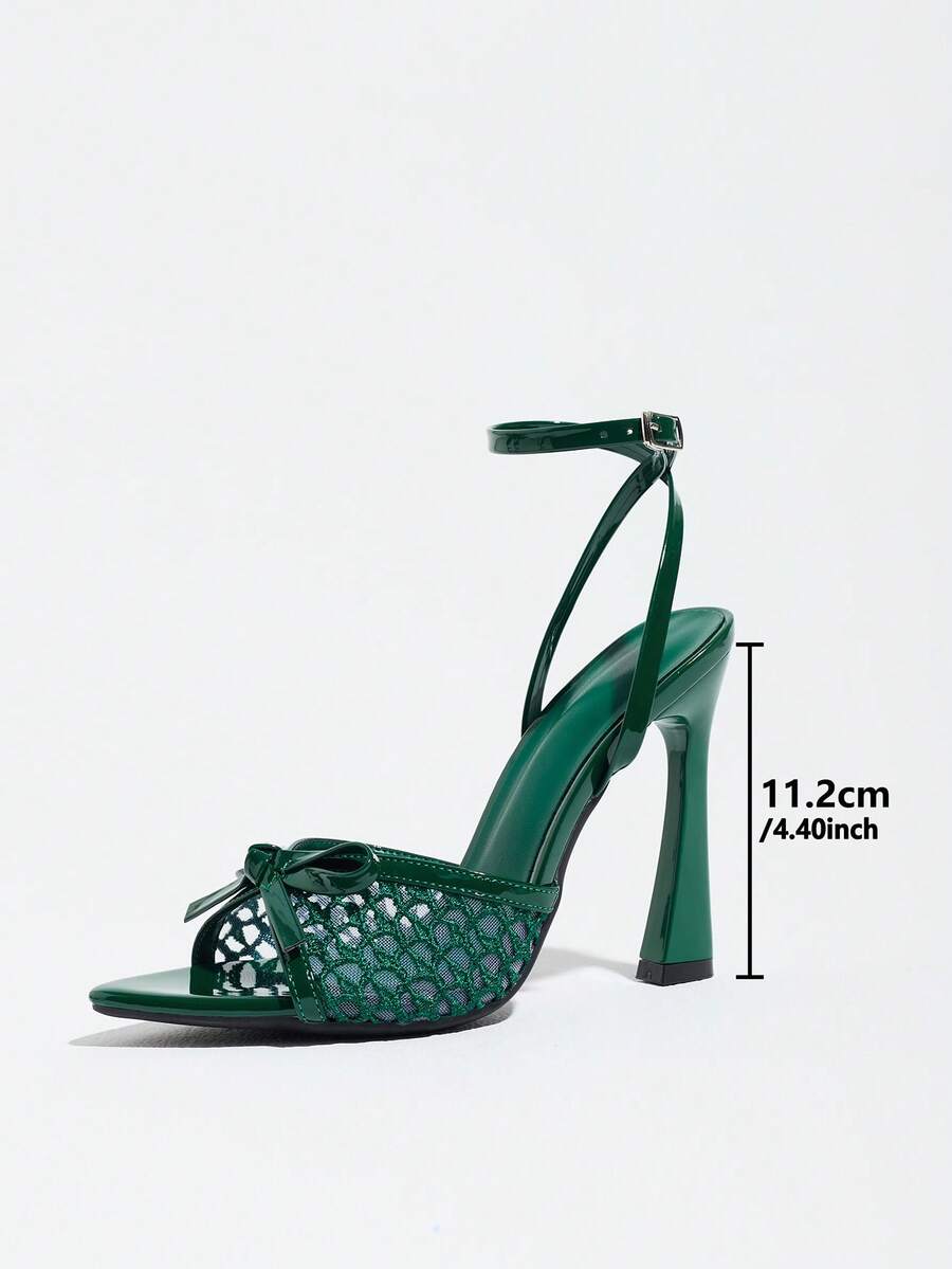 Burgundy open-toe high heels featuring an adjustable ankle strap with buckle closure and high stiletto heel.