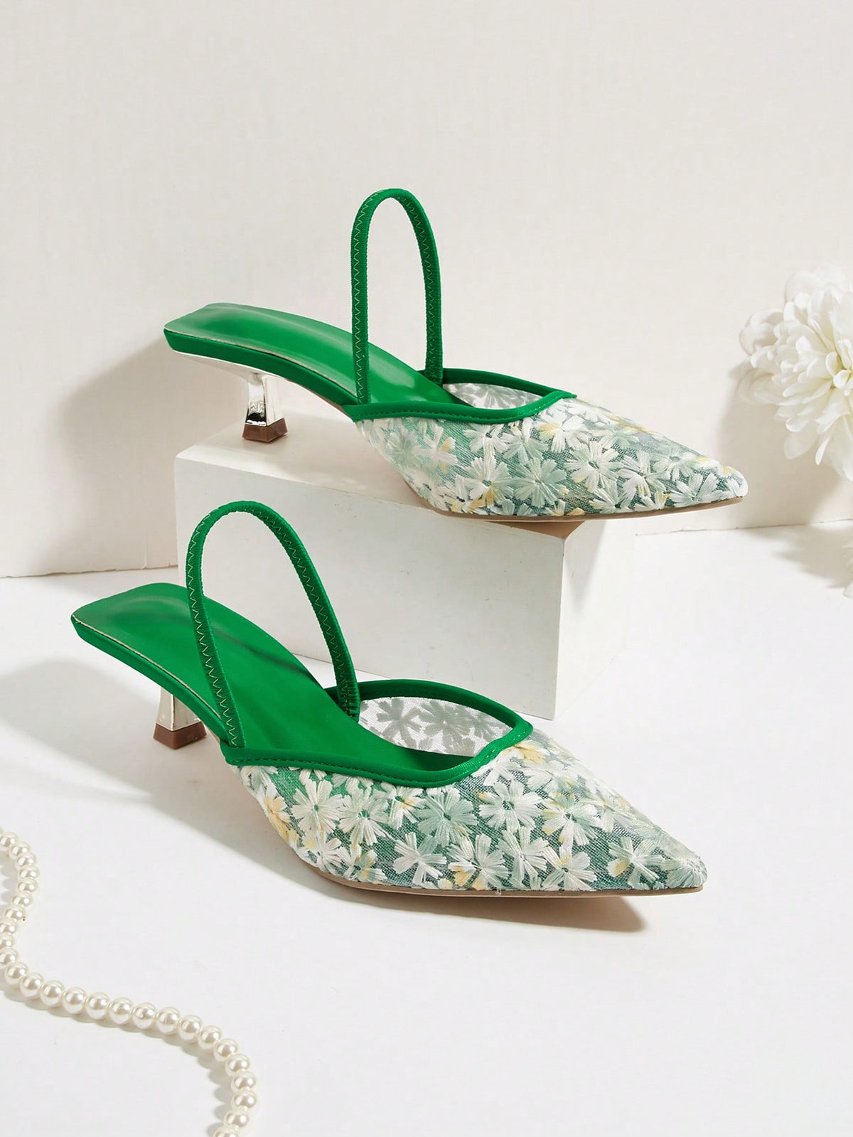 Women's pointed toe kitten heel pumps with leopard print suedette finish and slingback back strap.