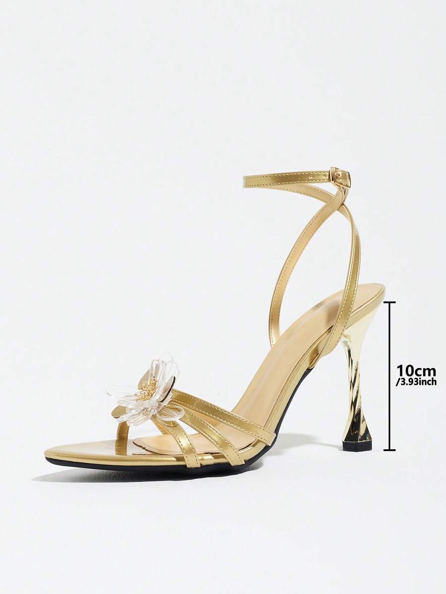 Women's black open toe stiletto heel sandals featuring lace mesh detailing, wide strap styling, and high stiletto heels.