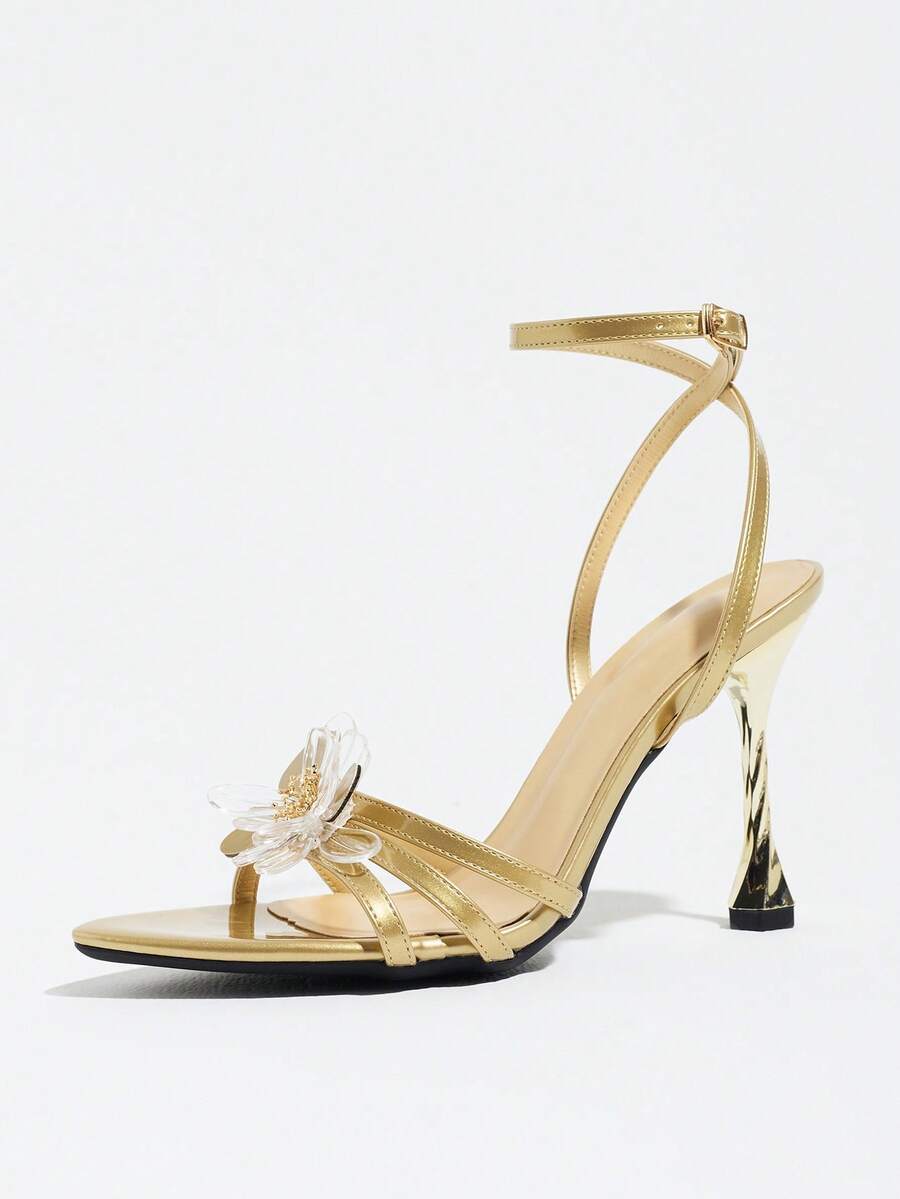 Women's black open toe stiletto heel sandals featuring lace mesh detailing, wide strap styling, and high stiletto heels.