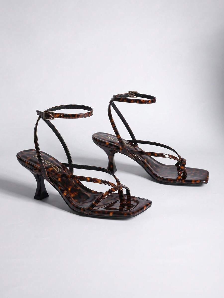 Pair of women's minimalist square toe kitten heeled thong sandals featuring slim ankle straps with buckle closure and sleek low heels.