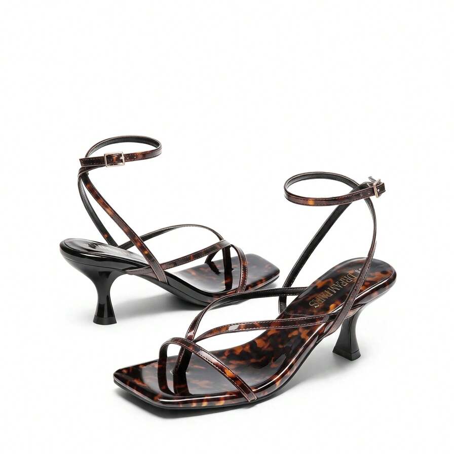 Pair of women's minimalist square toe kitten heeled thong sandals featuring slim ankle straps with buckle closure and sleek low heels.