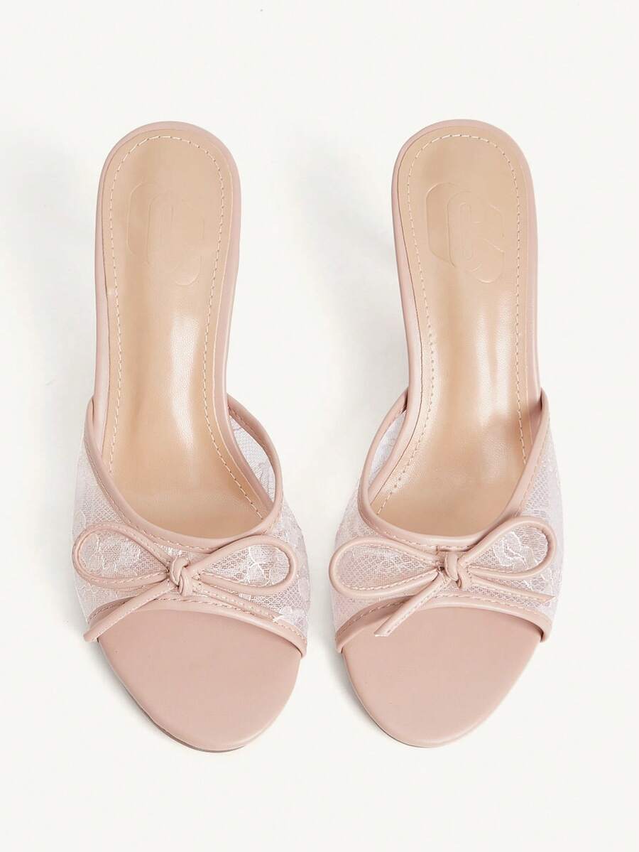Open toe high heel slide sandals featuring lace details and a bow accent on the upper strap.
