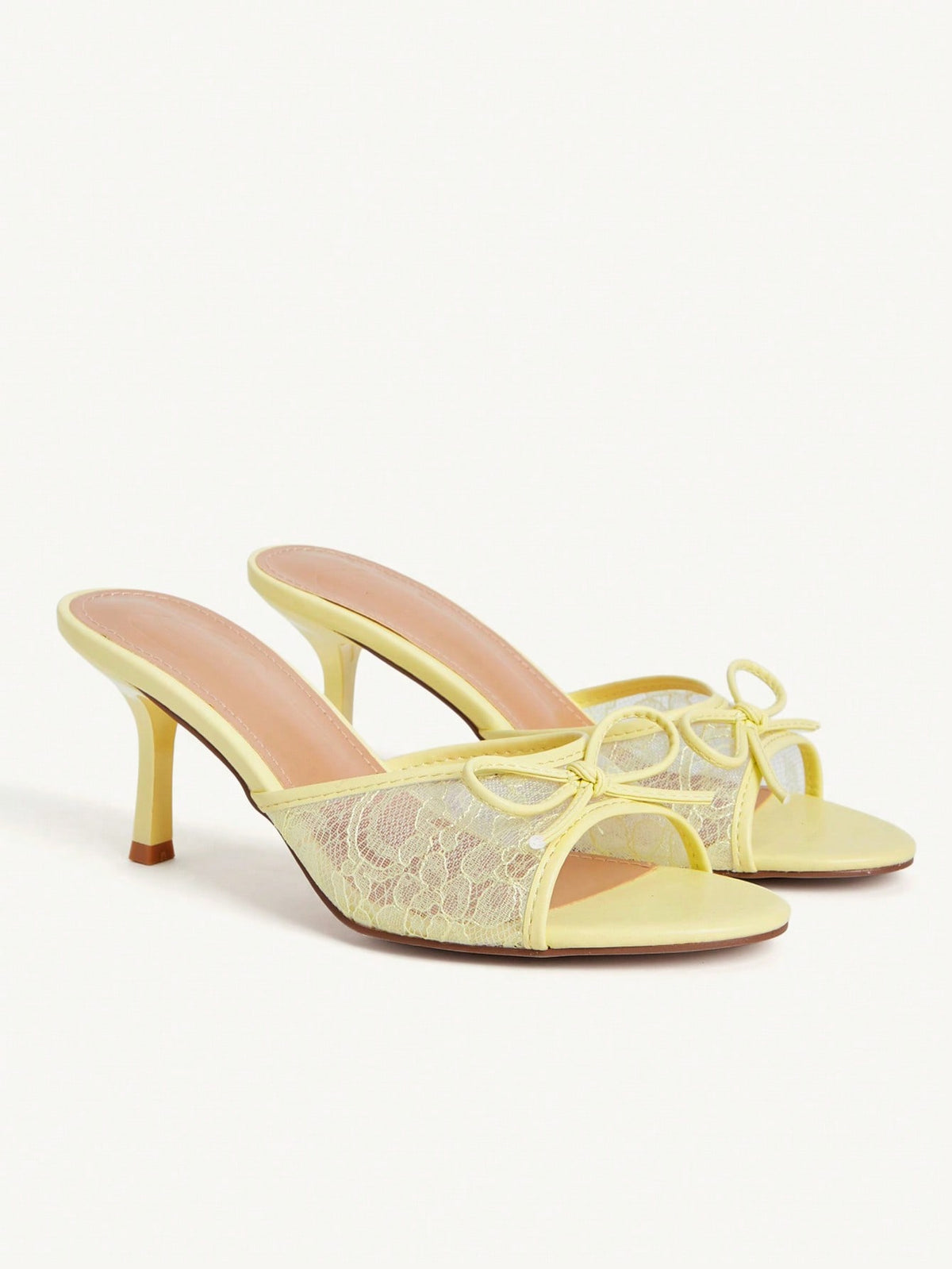 Open toe high heel slide sandals featuring lace details and a bow accent on the upper strap.