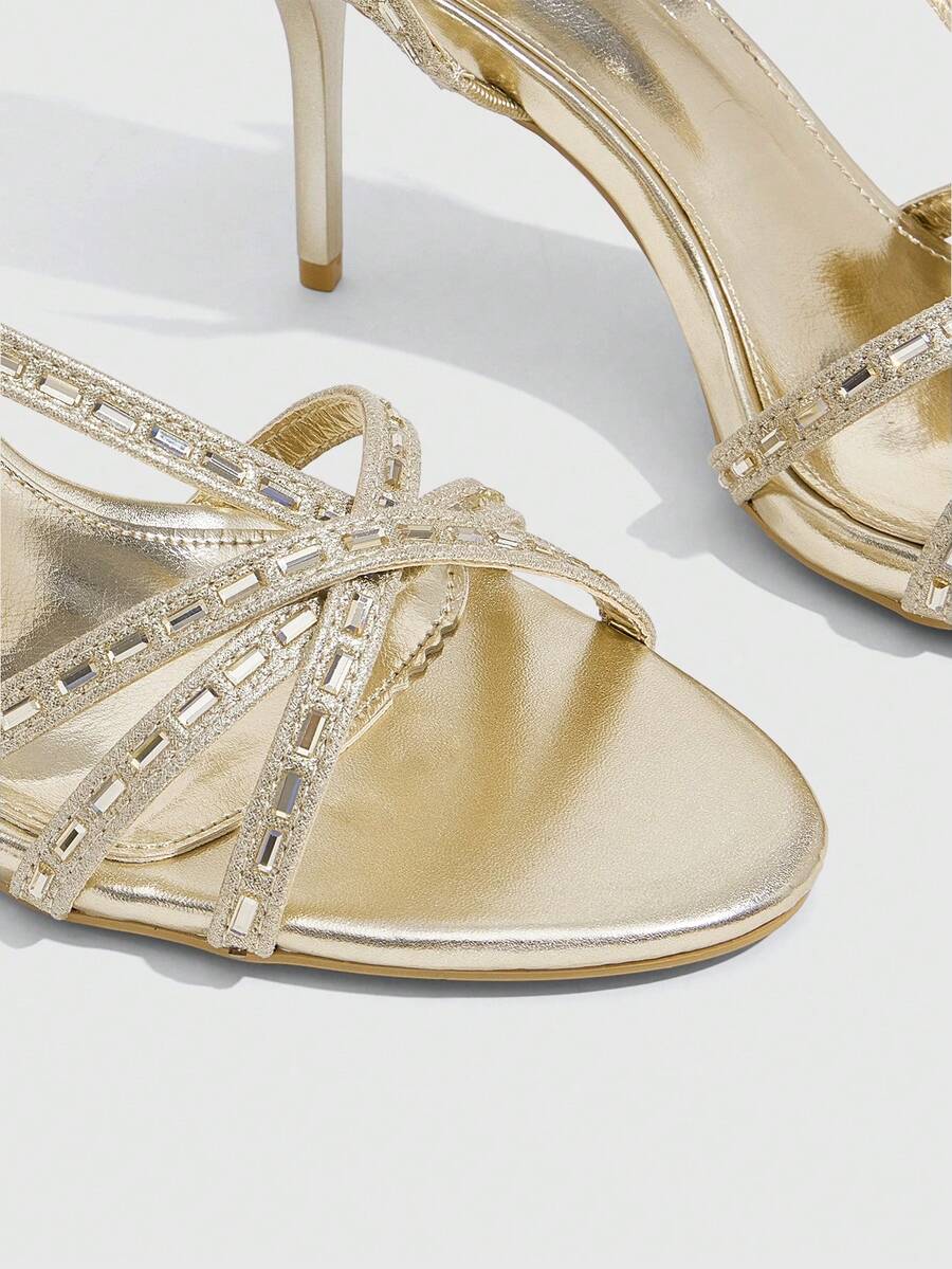 Women's open toe stiletto heel sandals featuring square toe design, criss-cross rhinestone slim straps, and secure ankle strap.