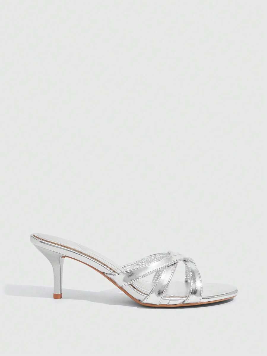 Square toe gold metallic heel sandals for women featuring open toe, crossover slingback strap, and stiletto mid heel for weddings and parties.