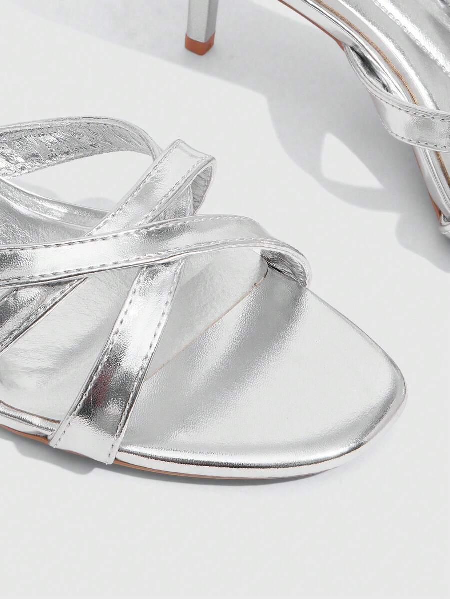 Square toe gold metallic heel sandals for women featuring open toe, crossover slingback strap, and stiletto mid heel for weddings and parties.