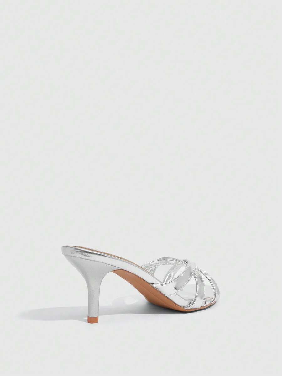 Square toe gold metallic heel sandals for women featuring open toe, crossover slingback strap, and stiletto mid heel for weddings and parties.