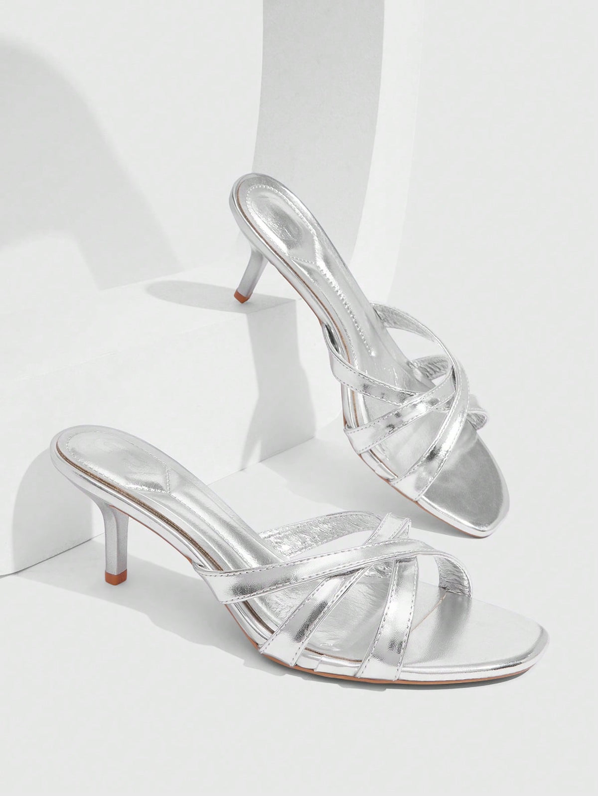 Square toe gold metallic heel sandals for women featuring open toe, crossover slingback strap, and stiletto mid heel for weddings and parties.