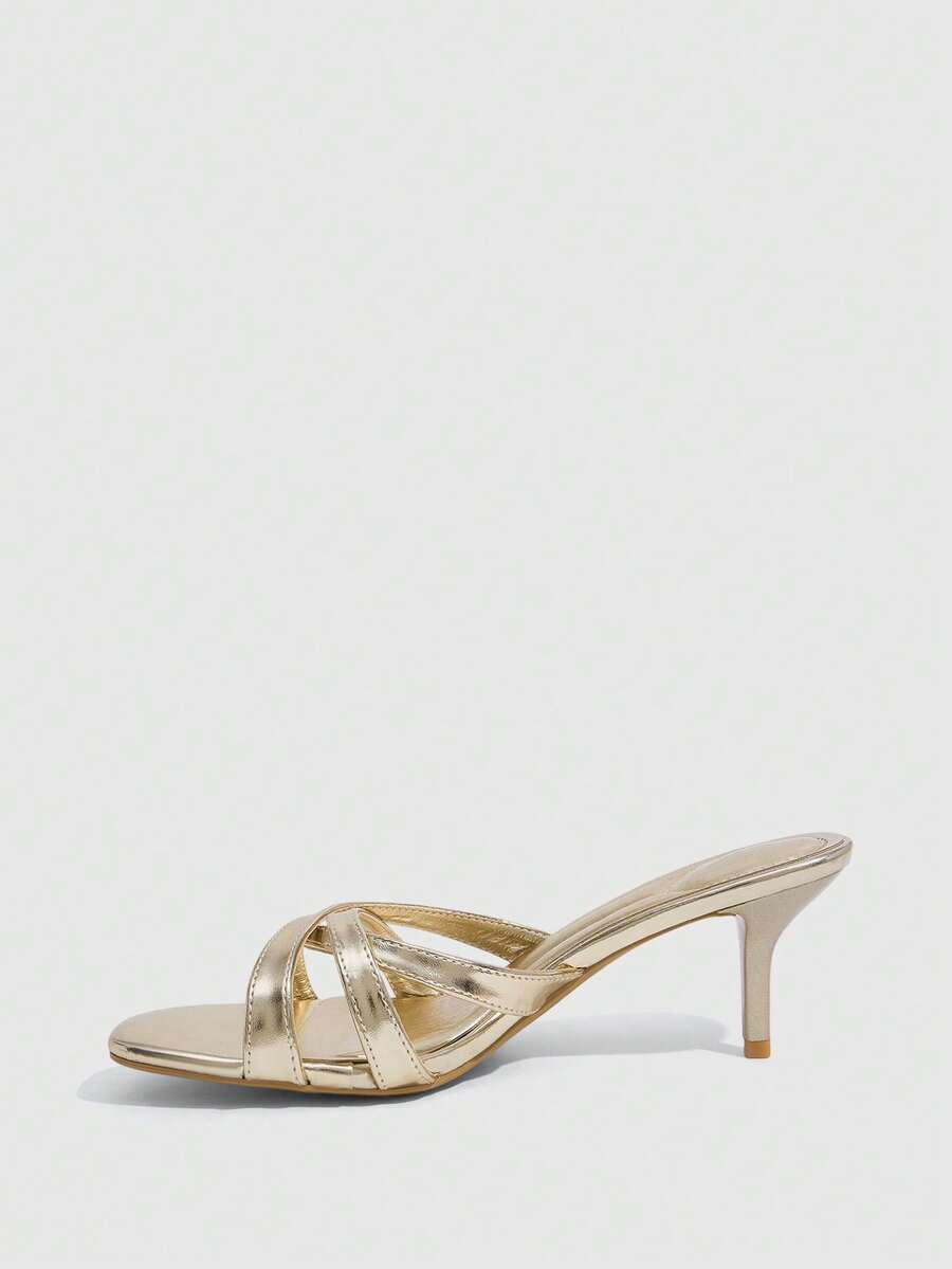 Square toe gold metallic heel sandals for women featuring open toe, crossover slingback strap, and stiletto mid heel for weddings and parties.