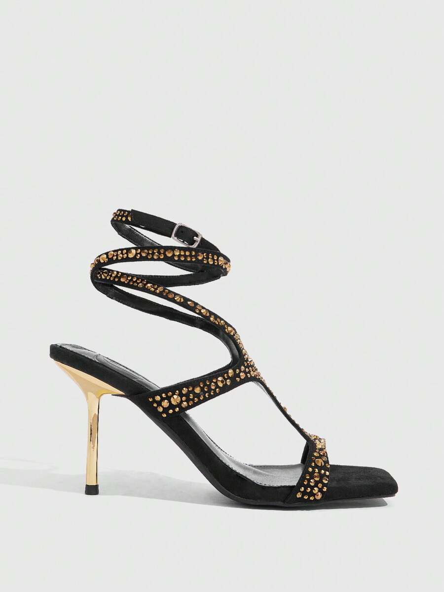 Square toe stiletto sandals featuring rhinestone straps, open toe design, and ankle wrap closures.