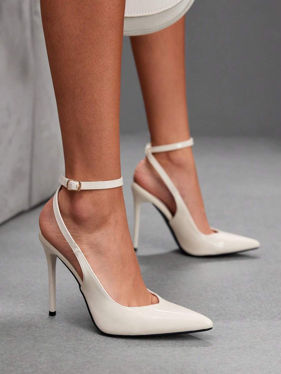 Pointed toe stiletto high heels with slingback silhouette and adjustable buckle ankle strap.