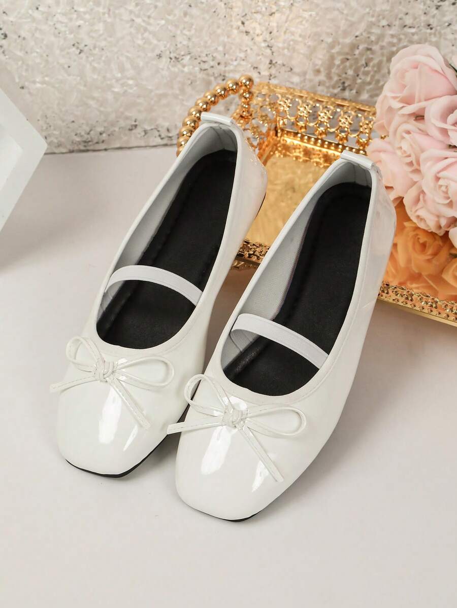 Square toe ballet flat shoes with bow detail and slip-on wide fit design.