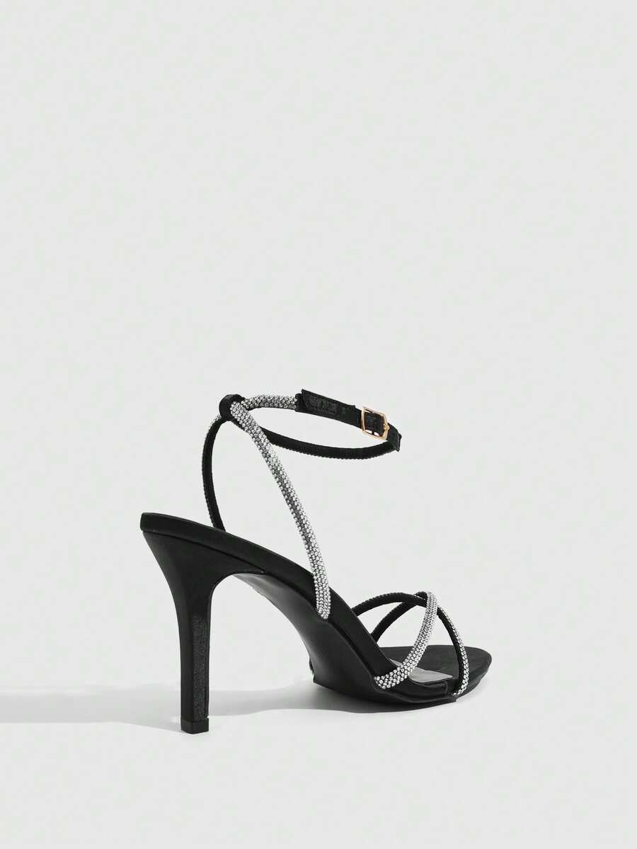 Women's open toe stiletto heel sandals featuring square toe design, criss-cross rhinestone slim straps, and secure ankle strap.