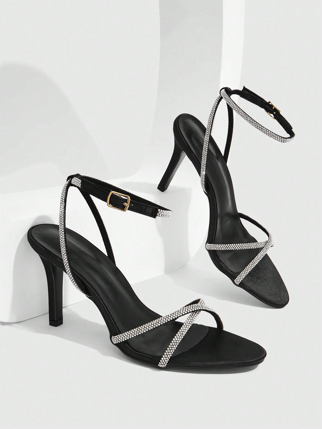 Women's open toe stiletto heel sandals featuring square toe design, criss-cross rhinestone slim straps, and secure ankle strap.