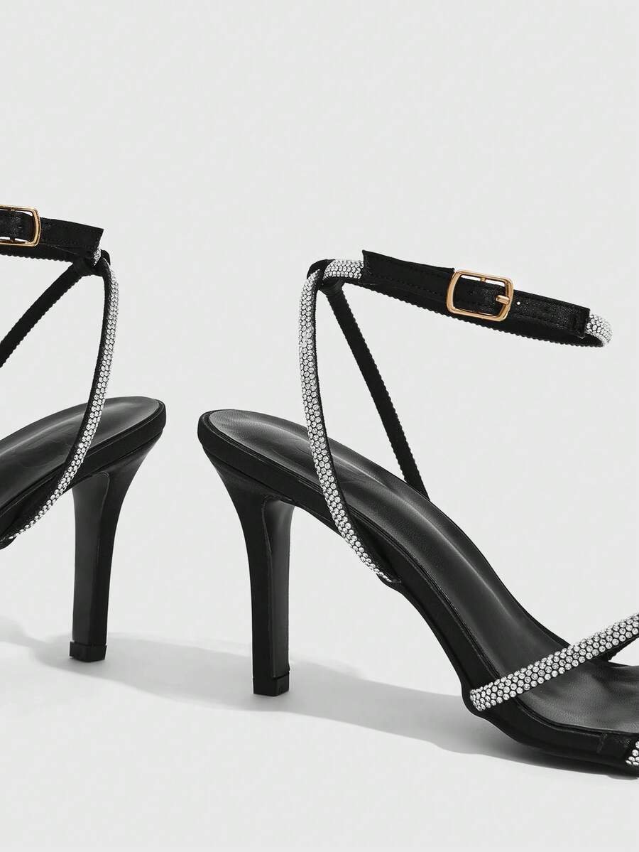 Women's open toe stiletto heel sandals featuring square toe design, criss-cross rhinestone slim straps, and secure ankle strap.
