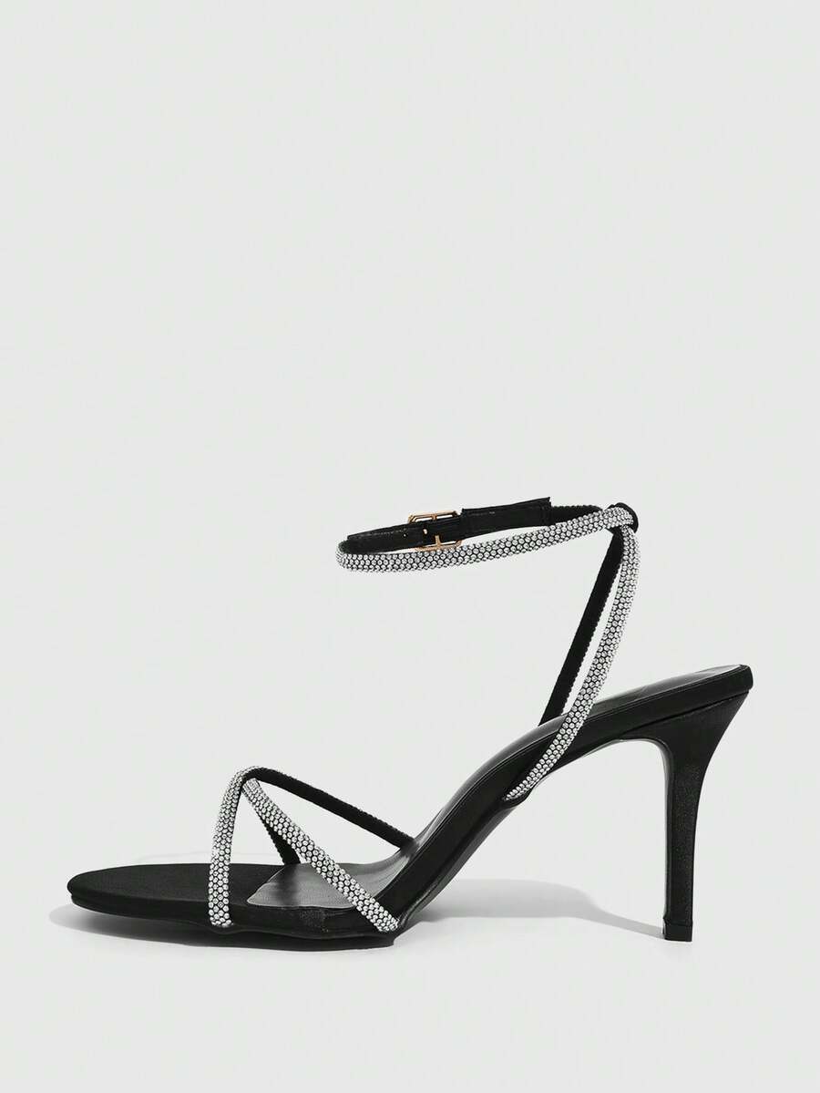 Women's open toe stiletto heel sandals featuring square toe design, criss-cross rhinestone slim straps, and secure ankle strap.