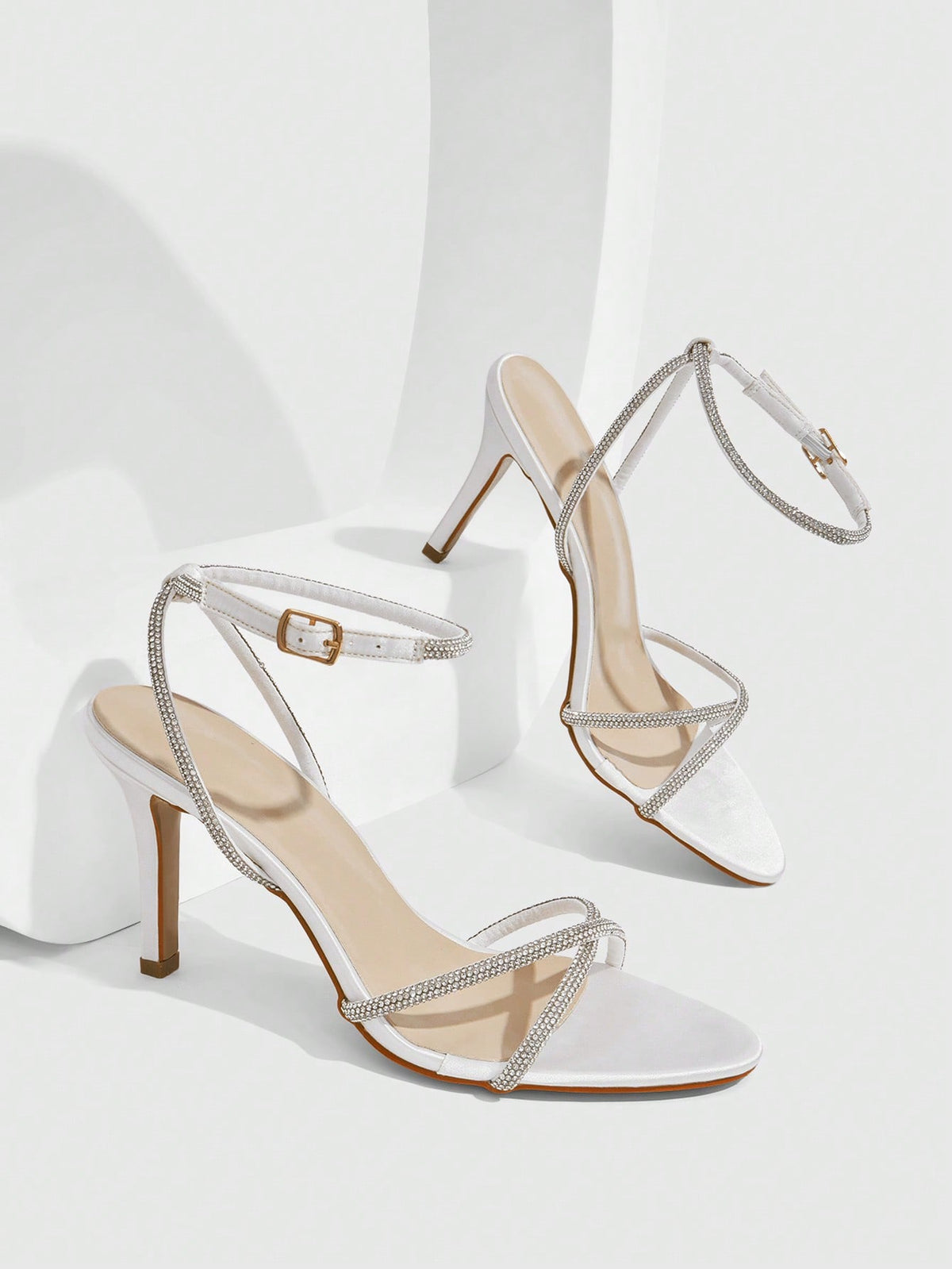 Women's open toe stiletto heel sandals featuring square toe design, criss-cross rhinestone slim straps, and secure ankle strap.