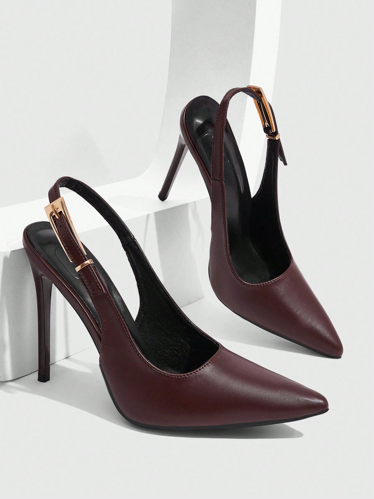 Pointed toe stiletto high heel evening party pumps featuring an ankle strap with buckle closure.