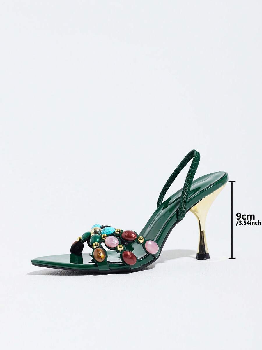 Pointed toe party high heels in gold featuring wavy lace trim, a stiletto heel, and back tie slingback straps.