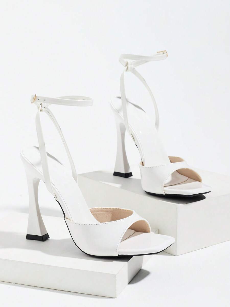Burgundy women's square toe high heel sandals featuring a mesh bow accent and ankle strap buckle on an open toe silhouette