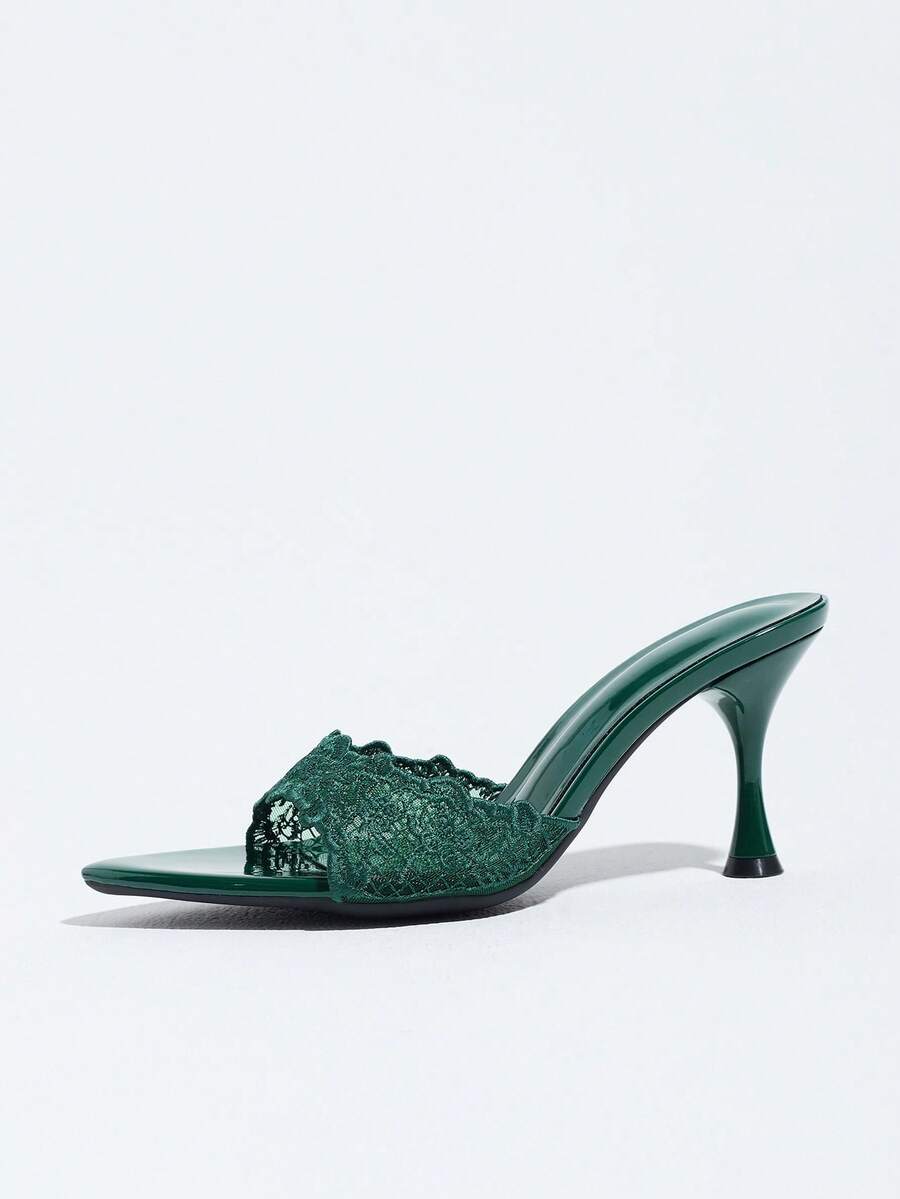 Women's pointed toe high heel mule sandals featuring a sleek slip-on design with elegant lace embroidery detailing