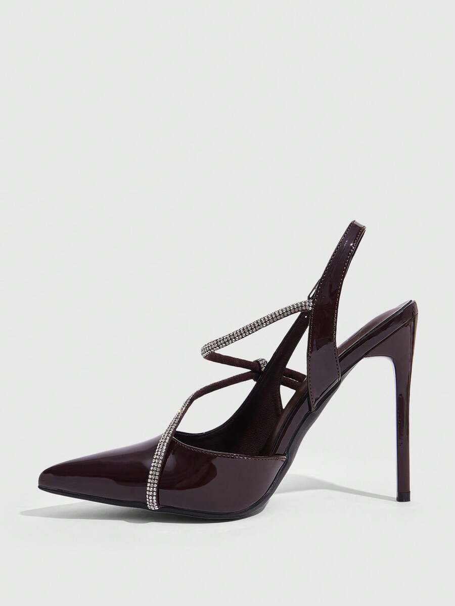 Pointed toe stiletto high heels with slingback silhouette and adjustable buckle ankle strap.