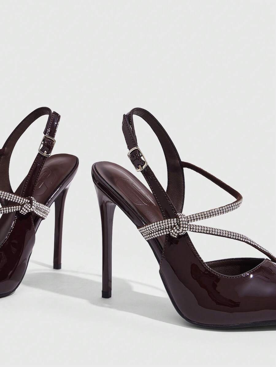 Pointed toe stiletto high heels with slingback silhouette and adjustable buckle ankle strap.