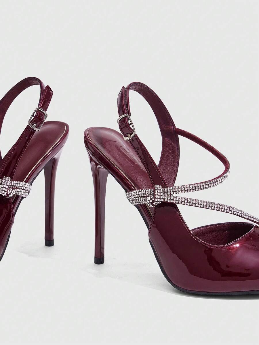 Pointed toe stiletto high heels with slingback silhouette and adjustable buckle ankle strap.