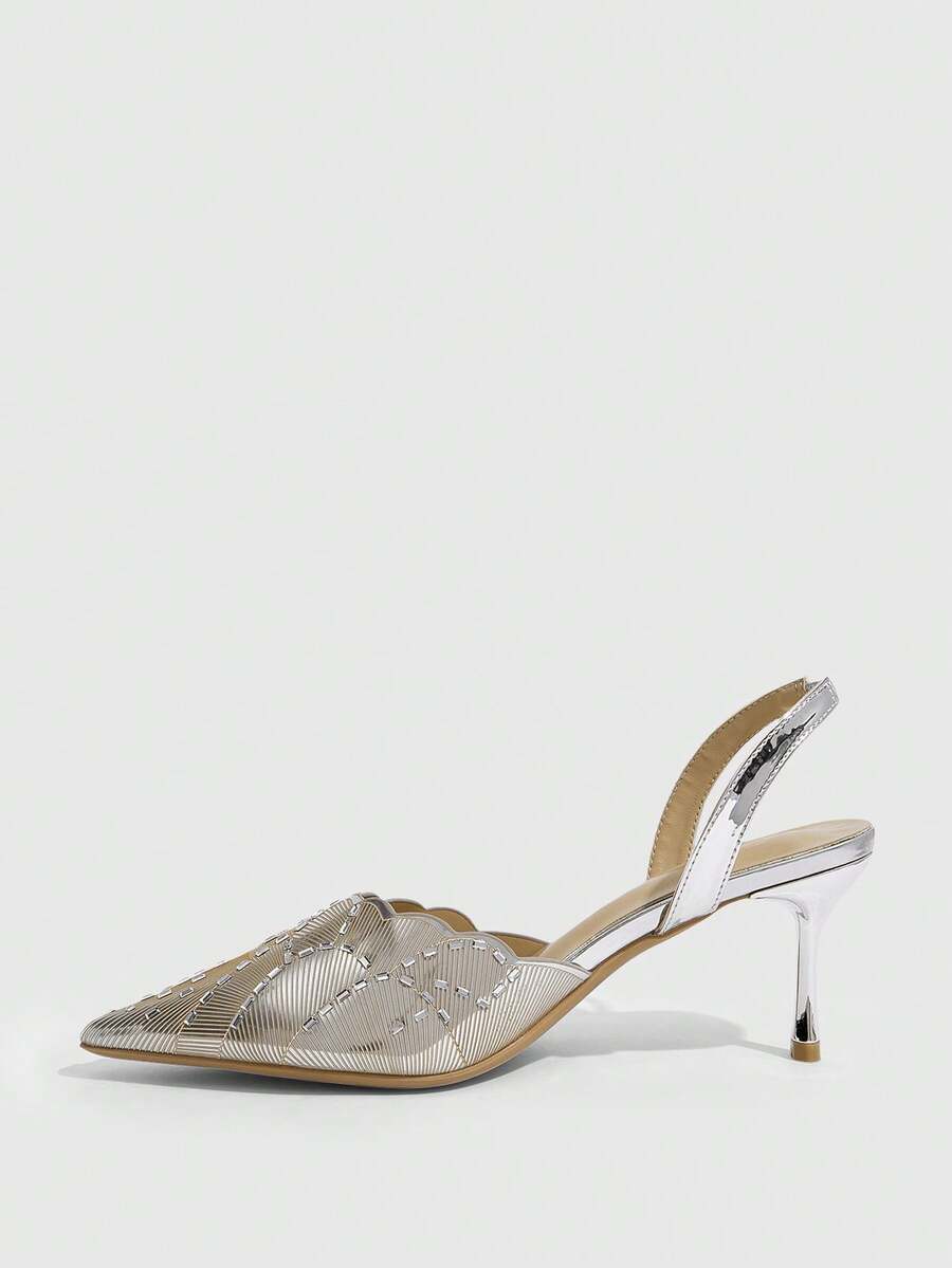 Pair of women's silver glitter pointed party heels with slingback straps, rhinestone accents, and stiletto heels.