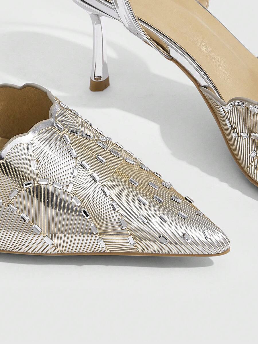 Pair of women's silver glitter pointed party heels with slingback straps, rhinestone accents, and stiletto heels.