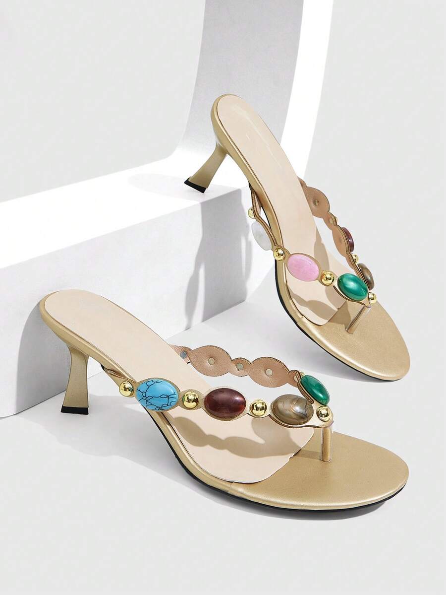 Elegant ladies strappy high-heeled slippers featuring a sleek toe post, buckle accent, and stiletto mid heel in smooth PU leather.