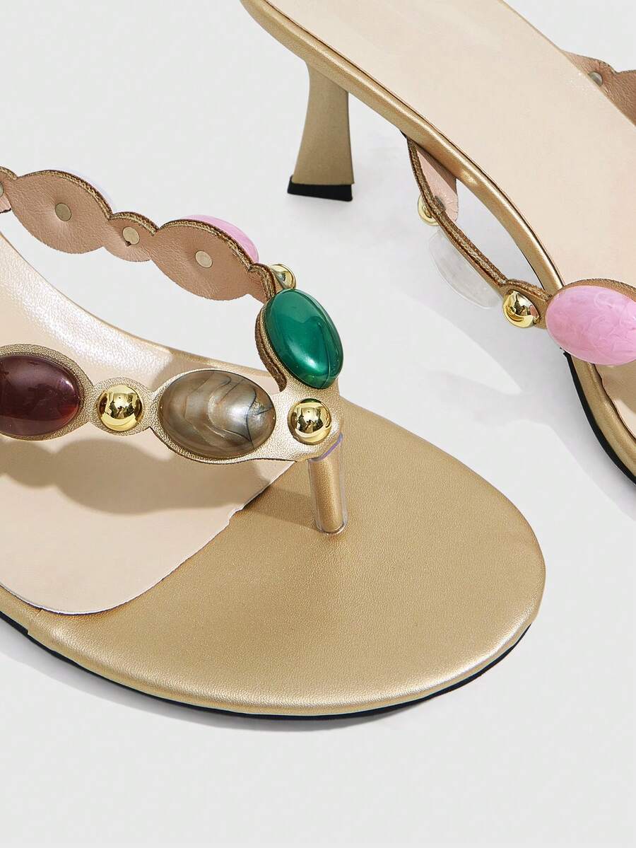 Elegant ladies strappy high-heeled slippers featuring a sleek toe post, buckle accent, and stiletto mid heel in smooth PU leather.