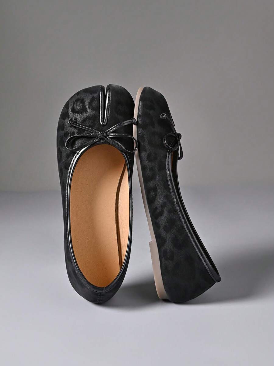 Women's white split-toe slip-on flat shoes with braided accent and rubber sole