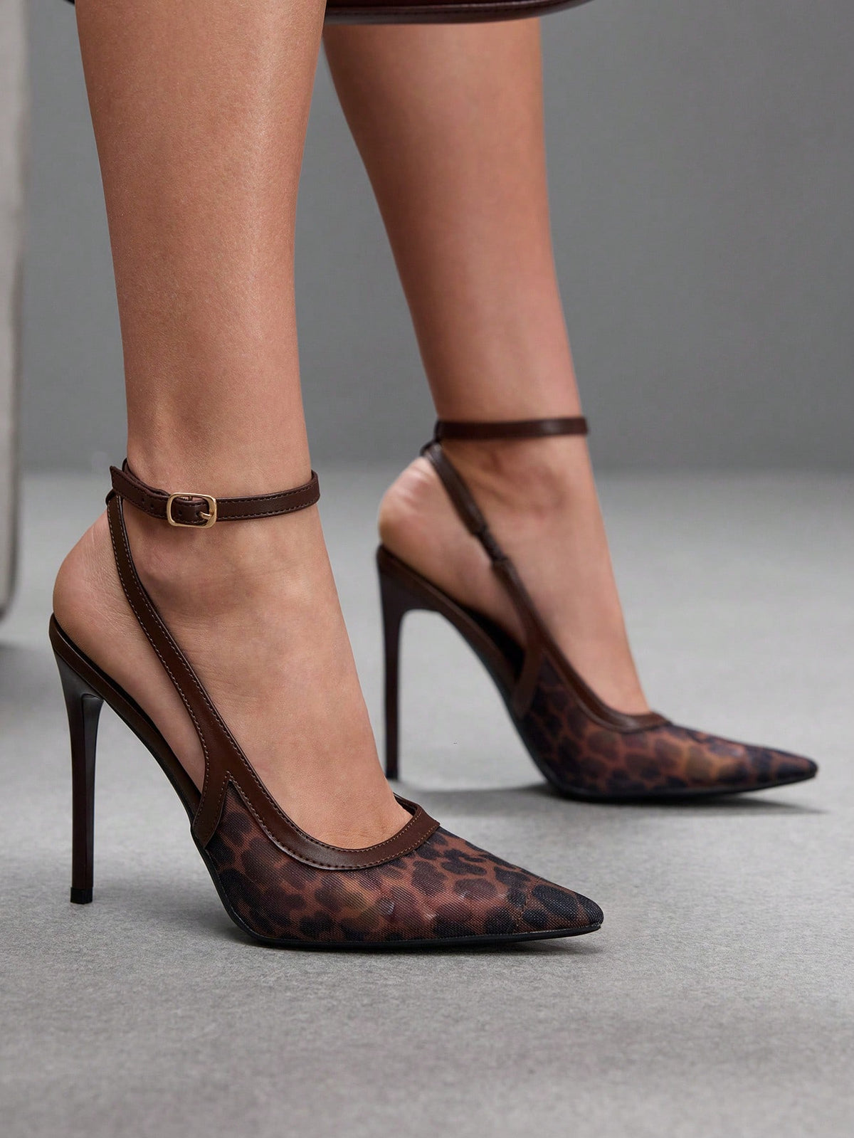 Women's pointed toe high heel shoes featuring breathable mesh detailing, stiletto heel, and adjustable ankle strap with buckle closure.