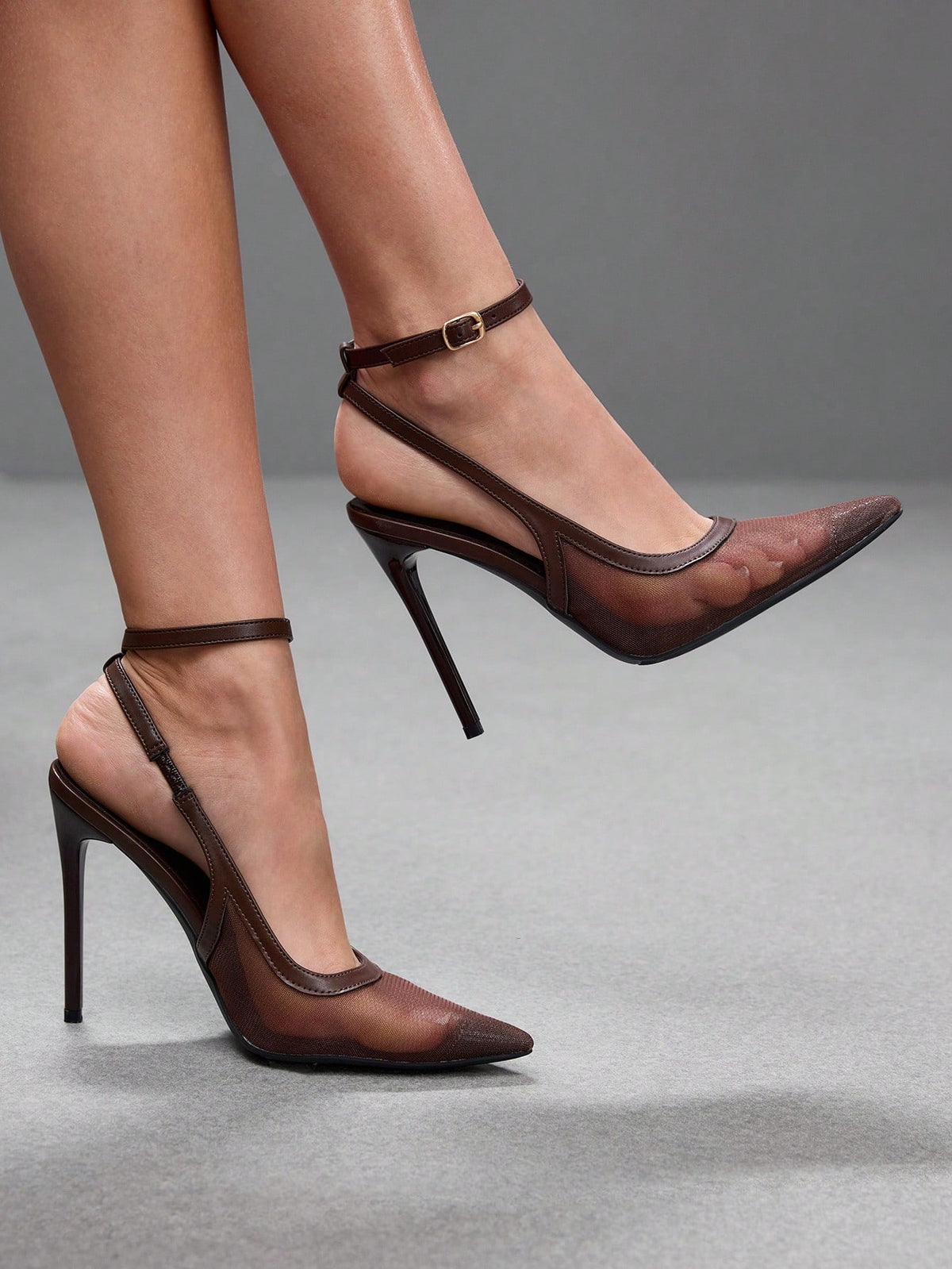 Women's pointed toe high heel shoes featuring breathable mesh detailing, stiletto heel, and adjustable ankle strap with buckle closure.