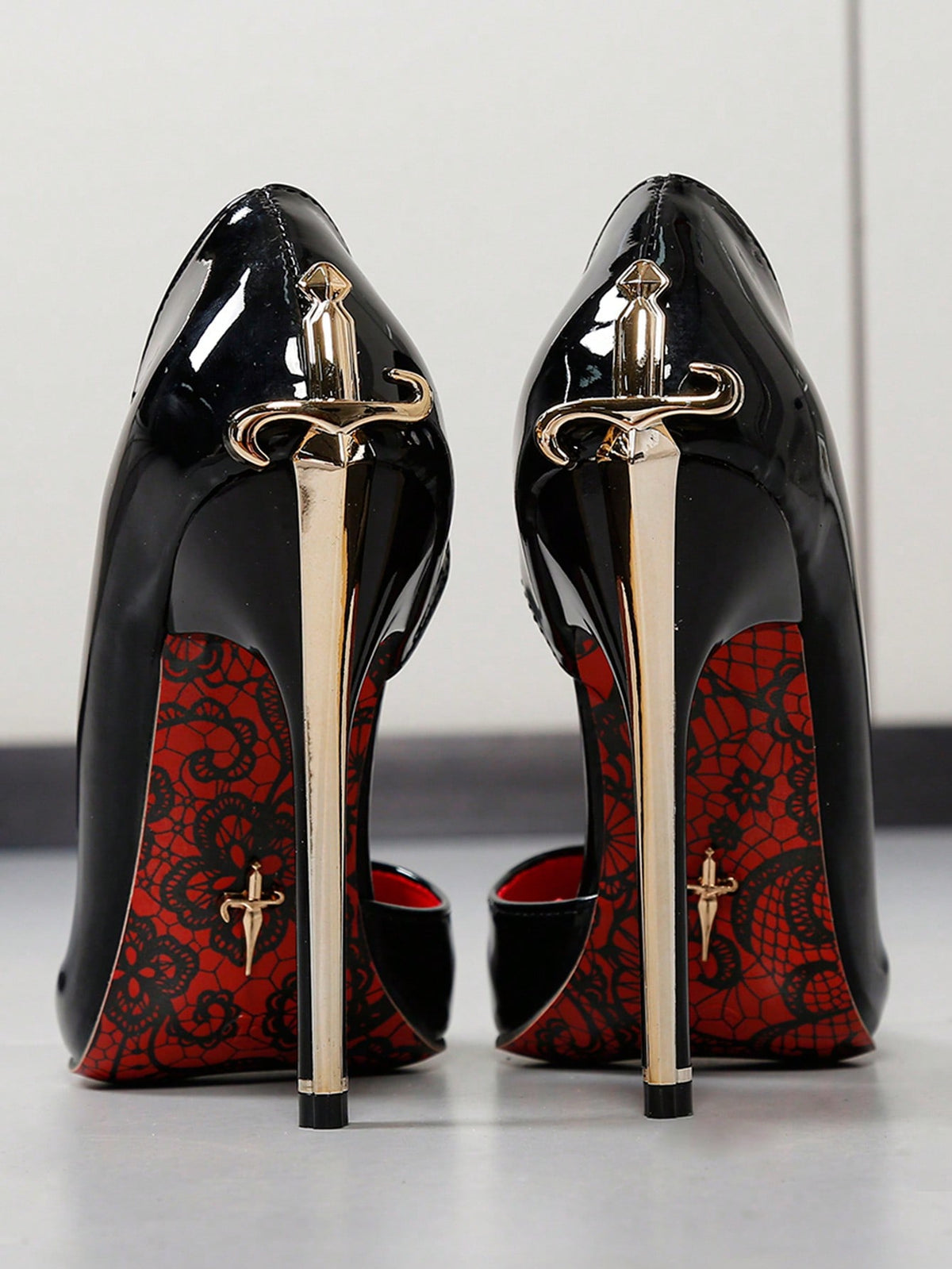 Glossy black pointed toe stiletto high heel pumps with bow detail for women