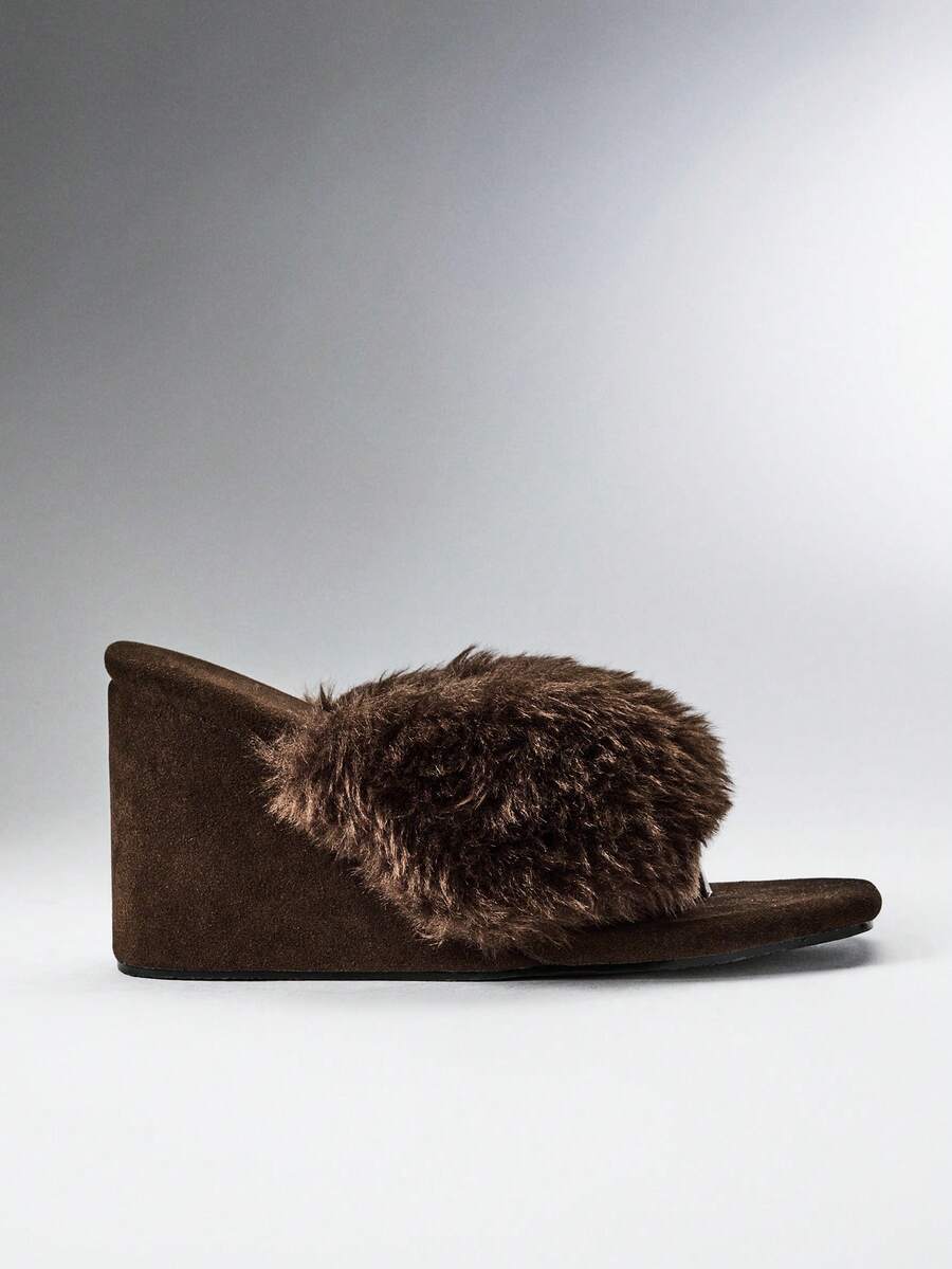 Women's slip-on thong strap wedge sandals featuring a high wedge heel and smooth PU leather upper.